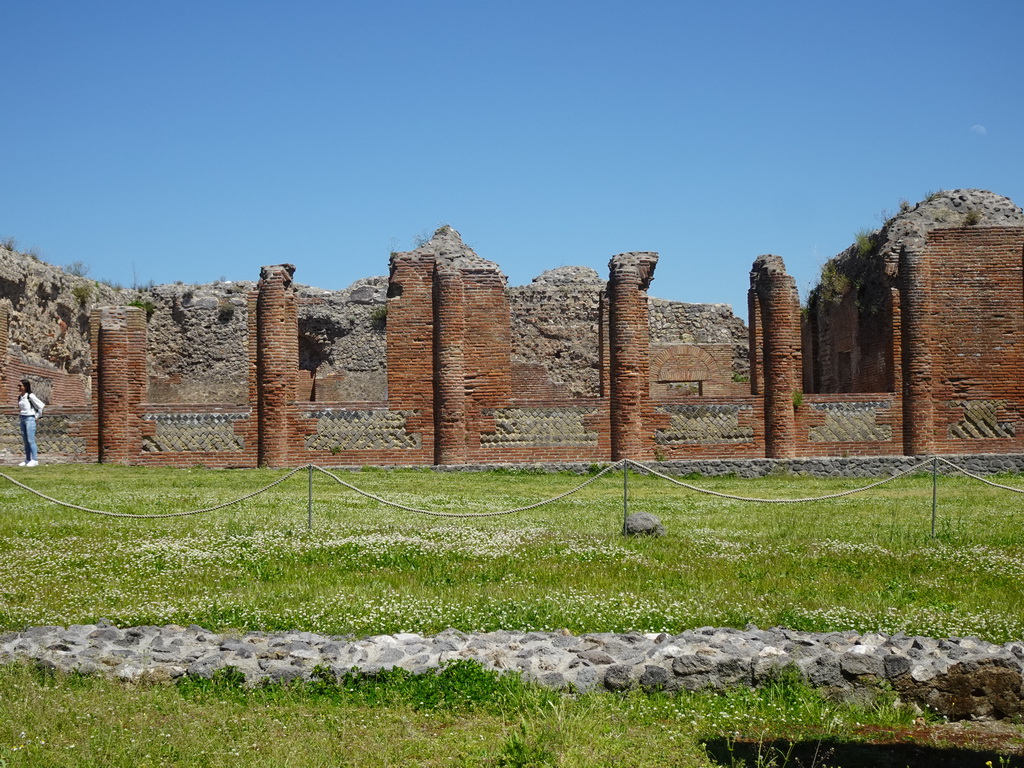 Courtyard, columns and walls at the Central Baths at the Pompeii Archeological Site, viewed from the Via Stabiana street