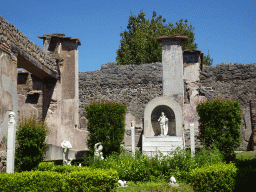 Statues, columns and walls at the Garden of the House of Marcus Lucretius at the Pompeii Archeological Site