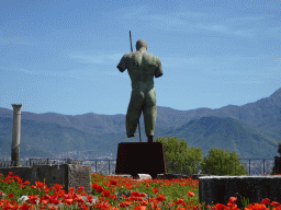 Back side of the statue of Daedalus by Igor Mitoraj at the Sanctuary of Venus at the Pompeii Archeological Site, viewed from the Via Marina street