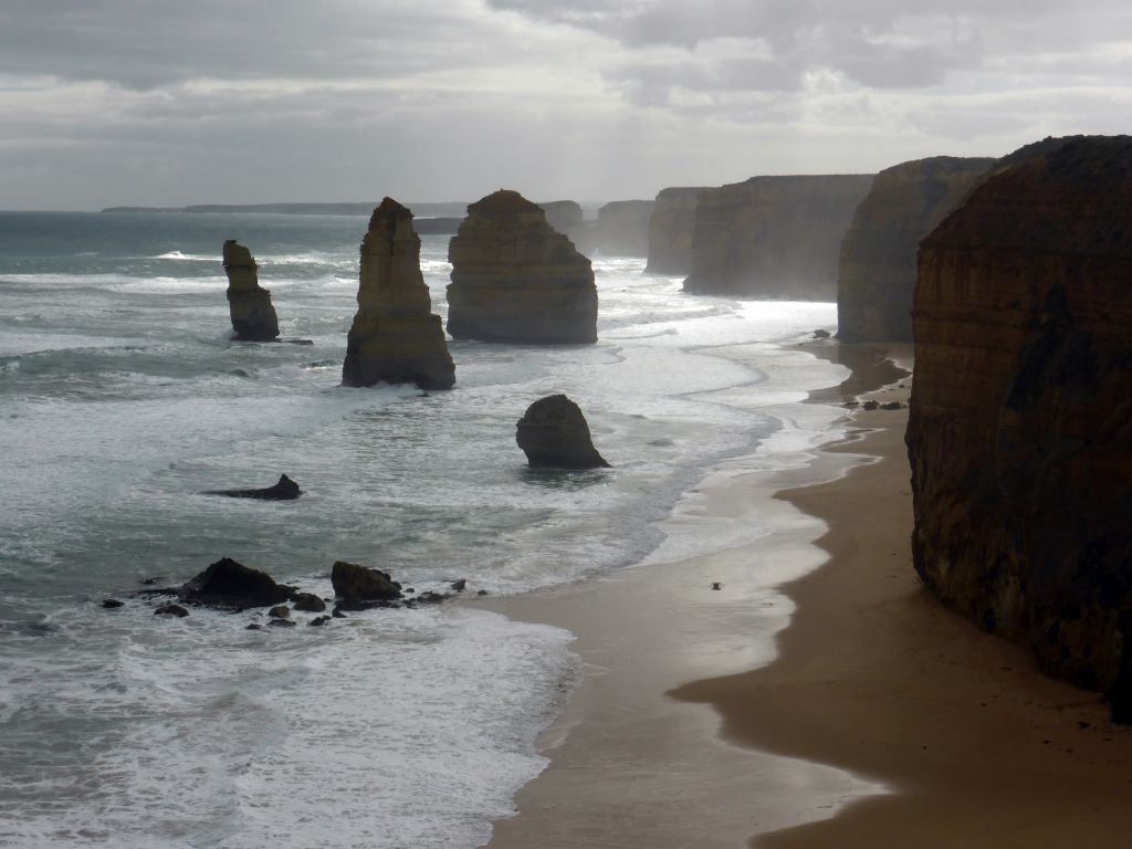 Beach and cliffs at the northwest side with the Twelve Apostles rocks, viewed from the Twelve Apostles viewing point