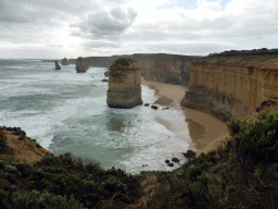 Beach and cliffs at the northwest side with the Twelve Apostles rocks, viewed from the Twelve Apostles viewing point