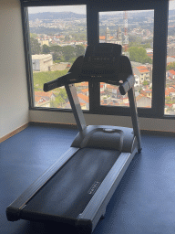 Home trainer at the fitness room at the Hotel Vila Galé Porto, with a view on the east side of the city with the Igreja Paroquial do Bonfim church