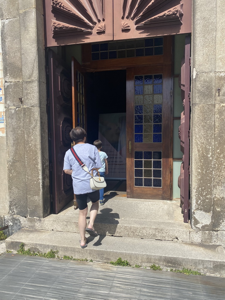 Miaomiao and Max in front of the Igreja de Santo Ildefonso church at the Praça da Batalha square