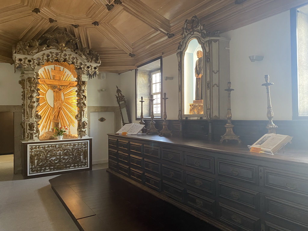 Crucifix and chandeleers at the museum of the Igreja de Santo Ildefonso church