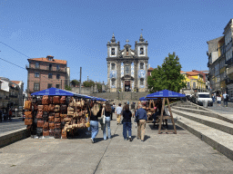 Market stalls at the Praça da Batalha square and the front of the Igreja de Santo Ildefonso church