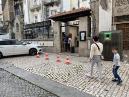 Miaomiao and Max in front of the Abadia do Porto restaurant at the Rua do Ateneu Comercial do Porto street