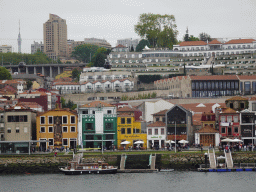 Boats on the Douro river and Vila Nova de Gaia, viewed from the Cais da Estiva street