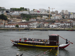 Boats on the Douro river and Vila Nova de Gaia, viewed from the Cais da Estiva street