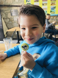 Max with a lollipop at the Grupo Desportivo Infante D. Henrique restaurant