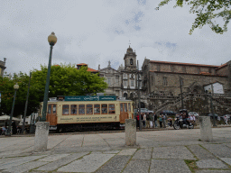The Rua do Infante D. Henrique street with an old tram and the front of the Igreja Monumento de São Francisco church