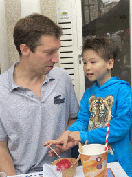 Tim and Max with ice cream and a drink at the terrace of the Flor de São Bento bakery at the Praça de Almeida Garrett square