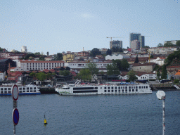 Boat on the Douro river and Vila Nova de Gaia, viewed from the sightseeing bus on the Rua Nova da Alfândega street