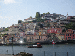 Boat on the Douro river and Vila Nova de Gaia, viewed from the sightseeing bus on the Rua de Monchique street