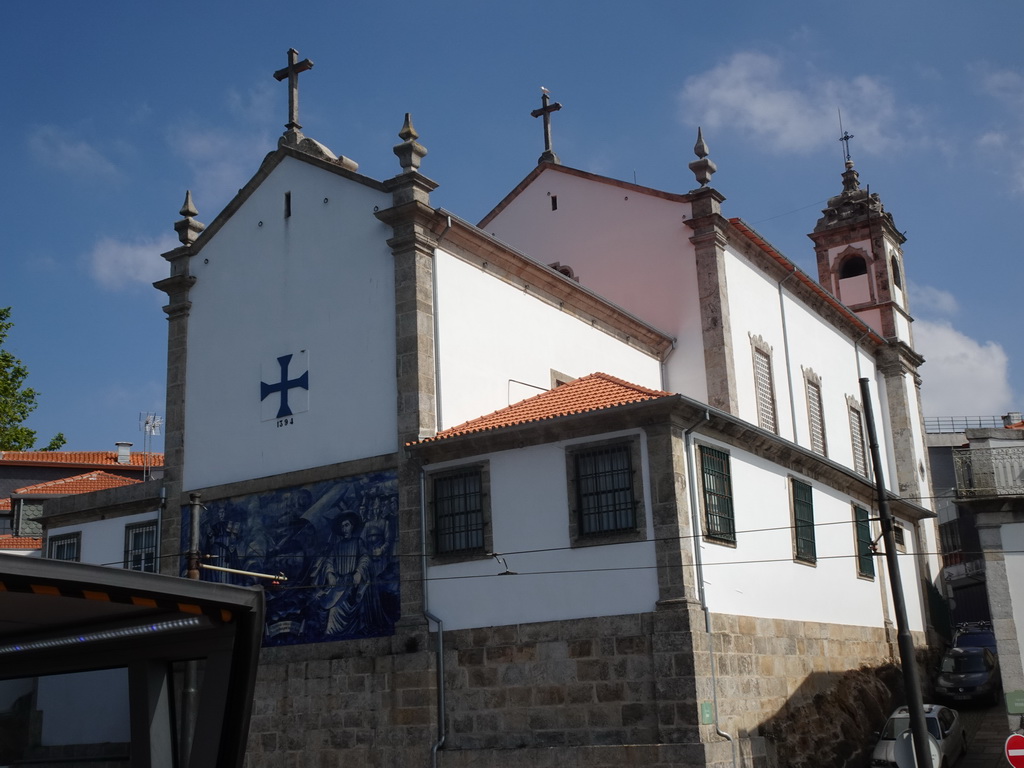 The southwest side of the Igreja Paroquial de Massarelos church at the Cais das Pedras street, viewed from the sightseeing bus on the Viaduto do Cais das Pedras viaduct