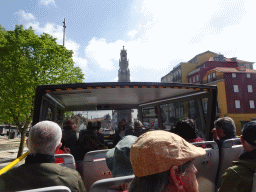 The sightseeing bus on the Campo dos Mártires da Pátria square, with a view on the Torre dos Clérigos tower