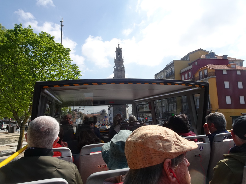 The sightseeing bus on the Campo dos Mártires da Pátria square, with a view on the Torre dos Clérigos tower