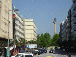 The Rua de Júlio Dinis street and the Praça de Mouzinho de Albuquerque square with the Monumento aos Heróis da Guerra Peninsular column, viewed from the sightseeing bus