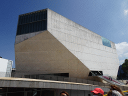 The southwest side of the Casa da Música theatre at the Avenida da Boavista street, viewed from the sightseeing bus