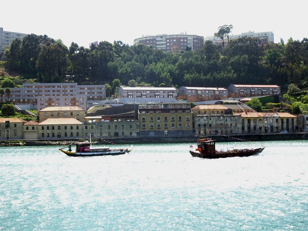 Boats on the Douro river and Vila Nova de Gaia, viewed from the sightseeing bus on the Ria do Ouro street