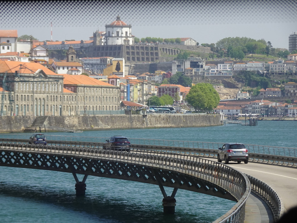 The Viaduto do Cais das Pedras viaduct over the Douro river, the Alfândega do Porto building and Vila Nova de Gaia with the Mosteiro da Serra do Pilar monastery, viewed from the sightseeing bus