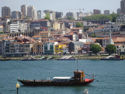 Boats on the Douro river and Vila Nova de Gaia with the Avenida de Diogo Leite street, viewed from the sightseeing bus on the Rua Nova da Alfândega street