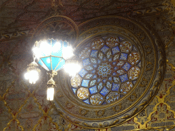 Chandeleer and stained glass window at the Arab Room at the northwest side of the upper floor of the Palácio da Bolsa palace