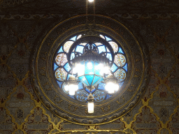 Chandeleer and stained glass window at the Arab Room at the northwest side of the upper floor of the Palácio da Bolsa palace