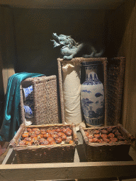 Chinese dragon statue, pottery and food at the On the Deck room at the World of Discoveries museum