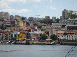Boats on the Douro river and Vila Nova de Gaia with the Avenida de Diogo Leite street and the Gaia Cable Car, viewed from the Rua Nova da Alfândega street