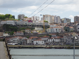 Boats on the Douro river and Vila Nova de Gaia with the Avenida de Diogo Leite street and the Gaia Cable Car, viewed from the Rua Nova da Alfândega street