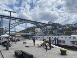 Musicians at the Cais da Ribeira street, with a view on the Ponte Luís I and Ponte Infante Dom Henrique bridges over the Douro river and Vila Nova de Gaia with the Mosteiro da Serra do Pilar monastery