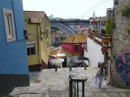 Miaomiao at the Escada dos Guindais staircase, with a view on the Ponte Luís I bridge over the Douro river and Vila Nova de Gaia