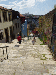 Miaomiao at the Escada dos Guindais staircase, with a view on the Ponte Luís I bridge over the Douro river and Vila Nova de Gaia