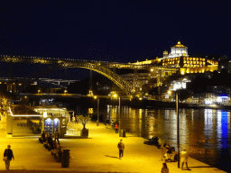The Cais da Estiva street, the Ponte Luís I bridge over the Douro river and Vila Nova de Gaia with the Mosteiro da Serra do Pilar monastery, by night