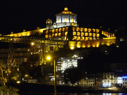 The Ponte Luís I bridge over the Douro river and Vila Nova de Gaia with the Mosteiro da Serra do Pilar monastery, viewed from the Cais da Estiva street, by night