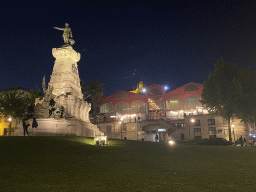 The Praça do Infante D. Henrique square with the statue of Infante D. Henrique and the Mercado Ferreira Borges market, by night