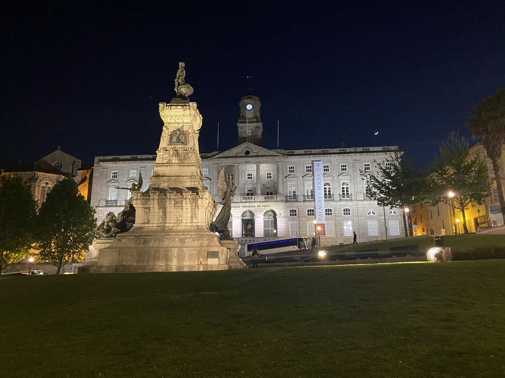 The Praça do Infante D. Henrique square with the statue of Infante D. Henrique and the front of the Palácio da Bolsa palace, by night