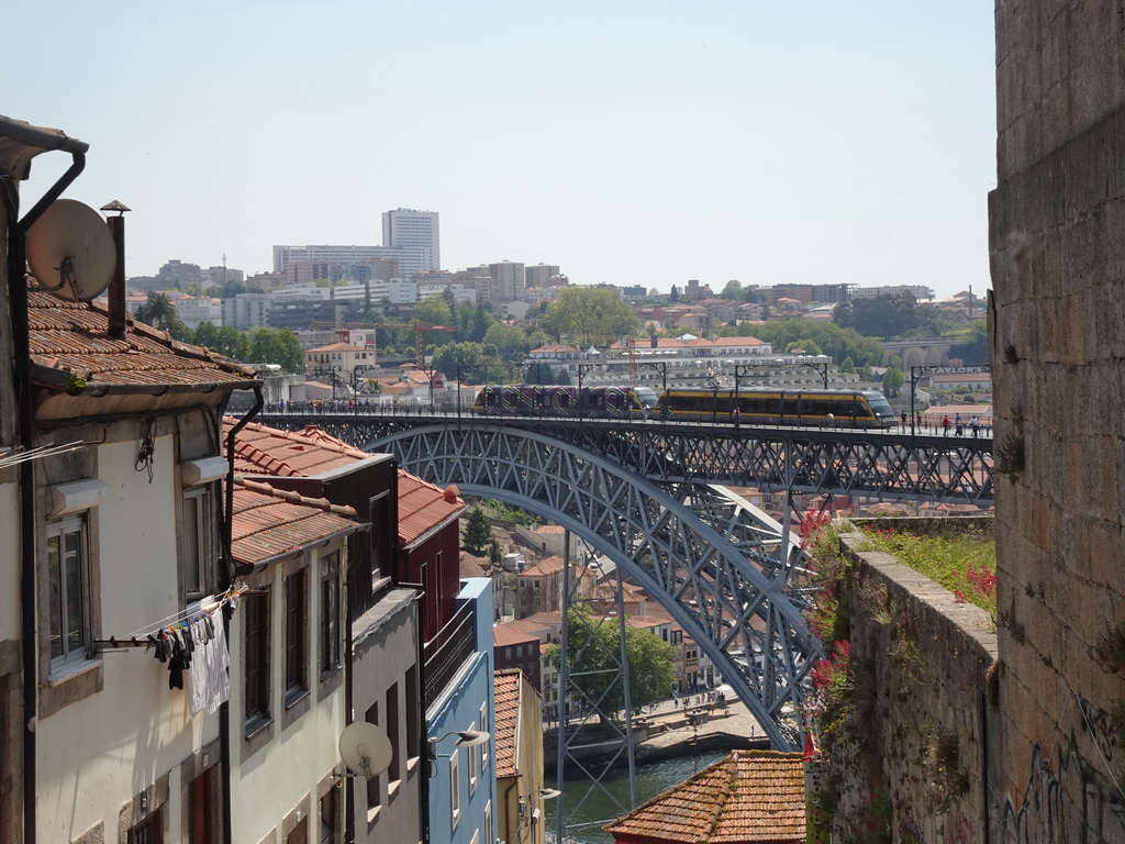 Subway train passing over the Ponte Luís I bridge over the Douro river and Vila Nova de Gaia, viewed from the Escada dos Guindais staircase