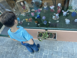 Max with toys in the window of the Ponto Cruz Concept Store at the Rua Arquitecto Nicolau Nasoni street