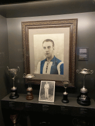 Photograph of João Lopes Martins and trophies at the FC Porto Museum at the Estádio do Dragão stadium, with explanation