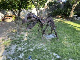 Dinosaur statue in the garden of the KUG Palácio restaurant