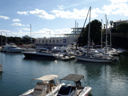 Boats in the northeast side of the harbour and the Club Náutico Porto Cristo, viewed from the Carretera del Moll street