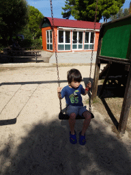 Max on a swing at the playground at the Zoo Area of the Safari Zoo Mallorca