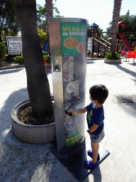 Max with a souvenir coin machine at the Zoo Area of the Safari Zoo Mallorca