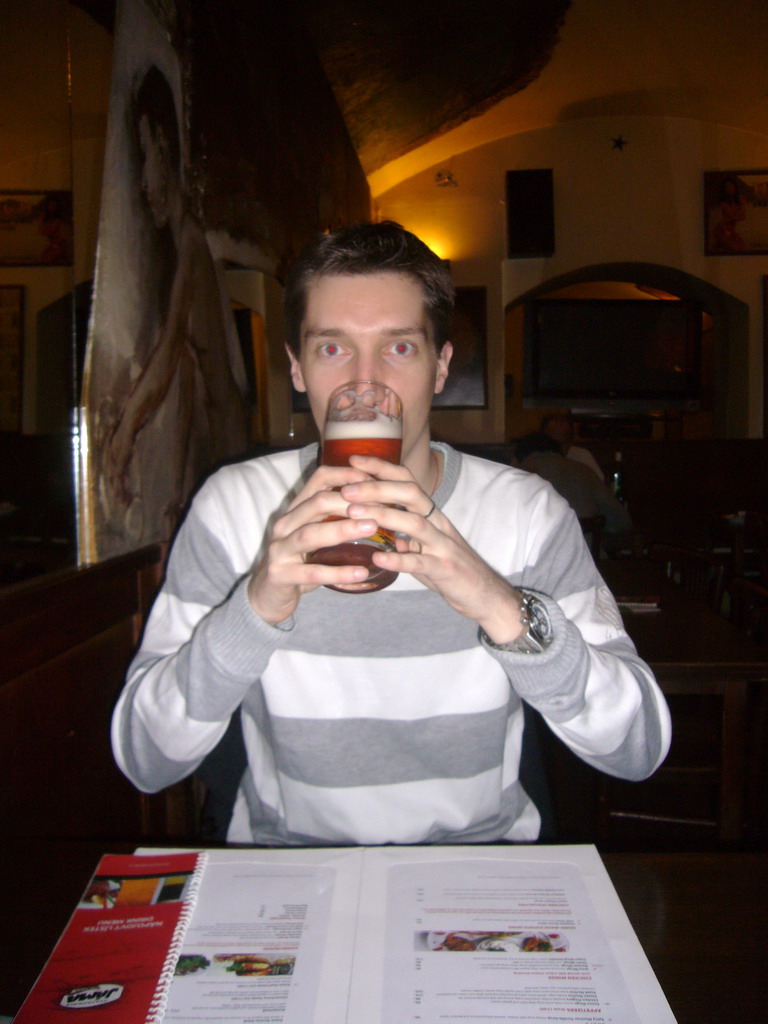 Tim having beer in a restaurant close to the hotel
