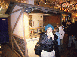 Miaomiao eating a Trdlo, in front of the Trdlo shop