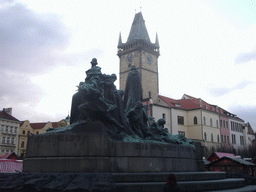 The Jan Hus Memorial and the tower of the Old Town Hall