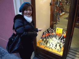 Miaomiao at a shopping window with toys