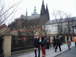 Tim and Miaomiao at the back side of Prague Castle, with the St. Vitus Cathedral and the Powder Tower