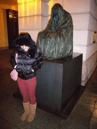 Miaomiao with the statue `Il Commendatore`, outside the Estates Theatre, at christmas night